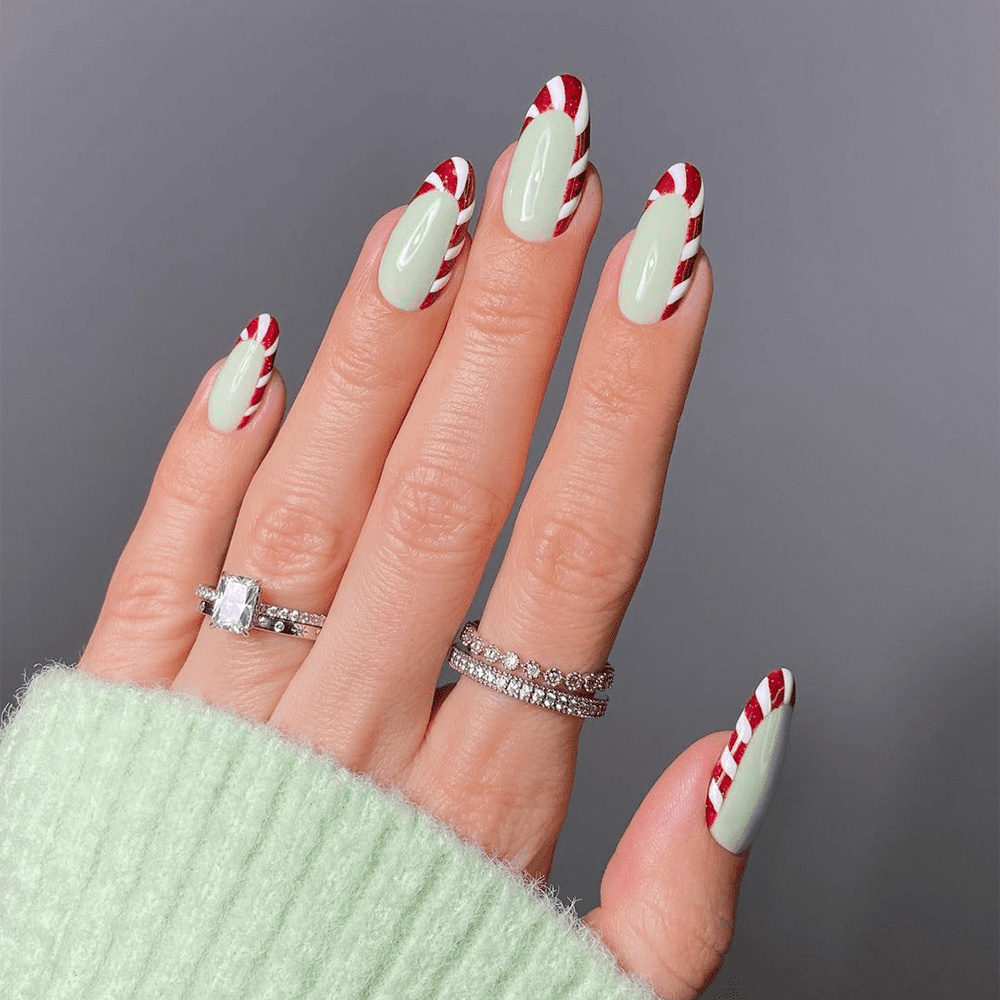 Christmas nails with candy cane stripes and swirls