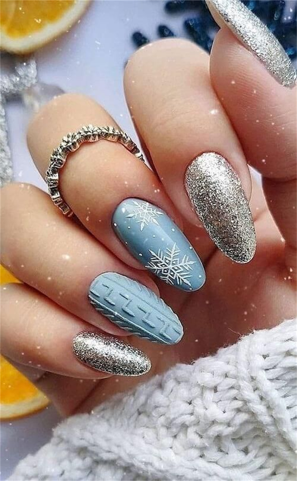 Christmas nails with a silver and blue winter sky design