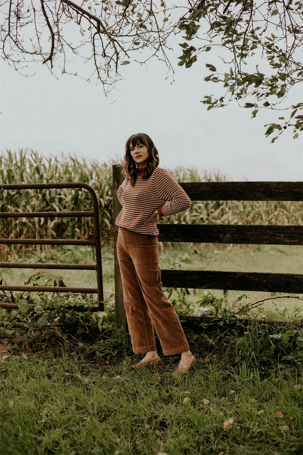 stylish corduroy pants and striped sweater outfit